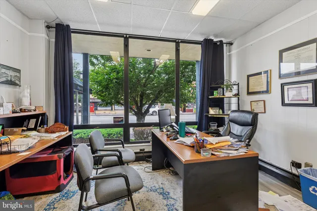 an aerial view of a residential houses with outdoor space