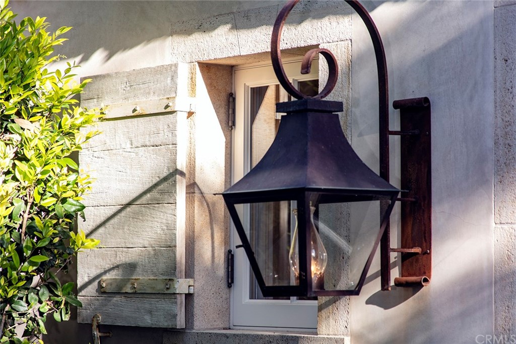 11 Needle Grass Irvine, CA 92603 - Photo 16 of 23 a view of staircase with a potted plant and a mirror