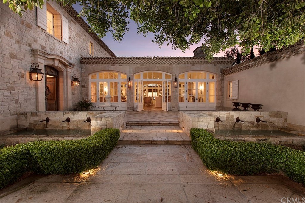 11 Needle Grass Irvine, CA 92603 - Photo 4 of 23 a front view of a house with garden