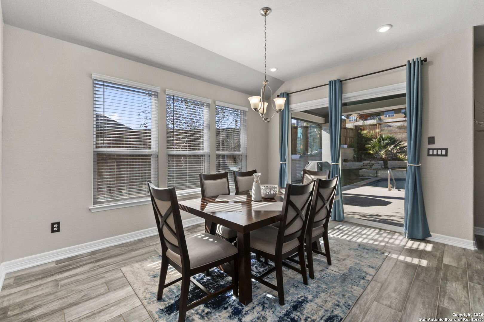 705 Tree Top Pass New Braunfels, TX 78130 - Photo 13 of 49 a view of a dining room with furniture window and outside view