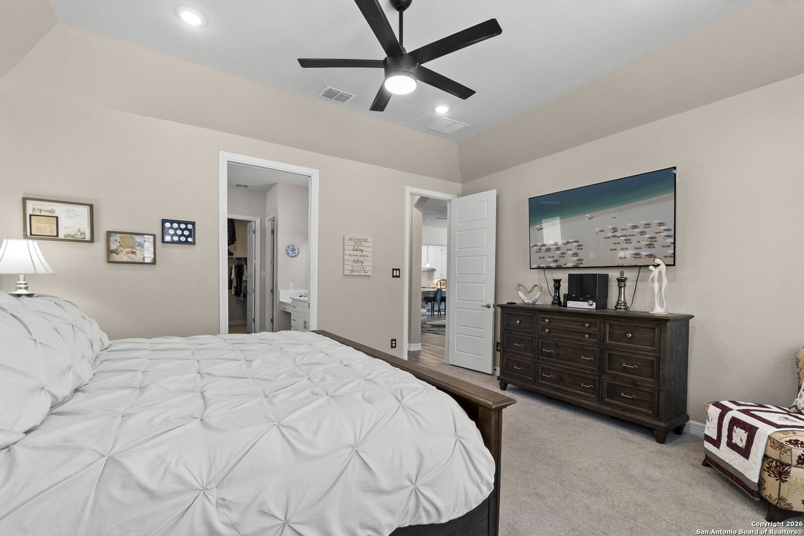 705 Tree Top Pass New Braunfels, TX 78130 - Photo 18 of 49 a bedroom with a bed and a dresser