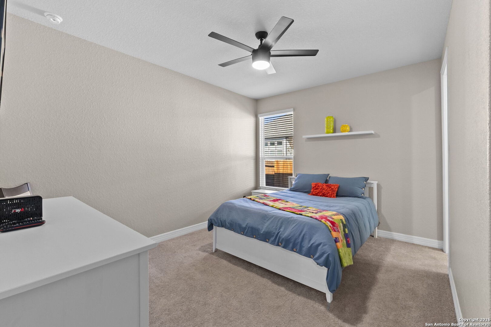 705 Tree Top Pass New Braunfels, TX 78130 - Photo 21 of 49 a bedroom with a bed and a chandelier