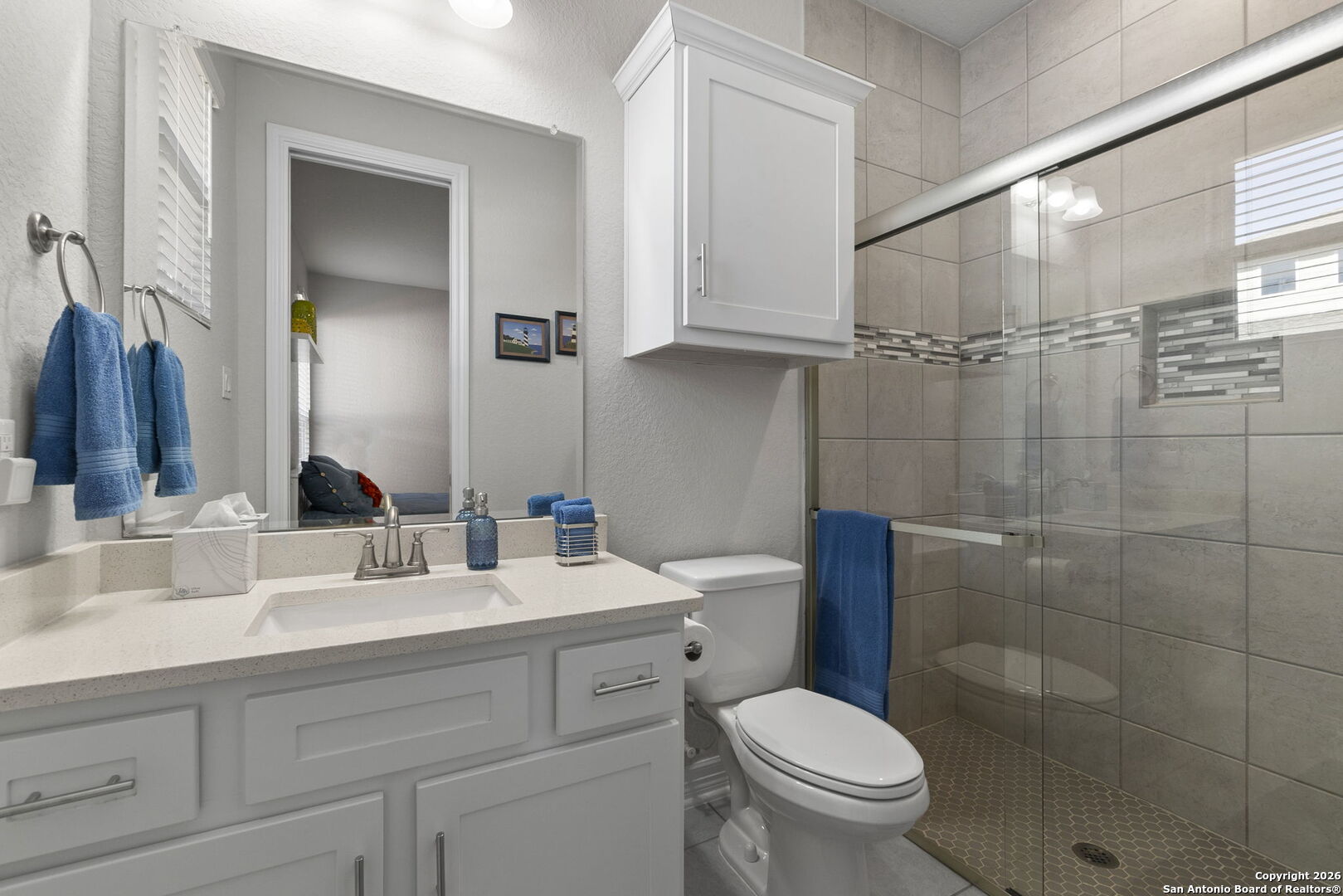 705 Tree Top Pass New Braunfels, TX 78130 - Photo 22 of 49 a bathroom with a toilet sink and mirror