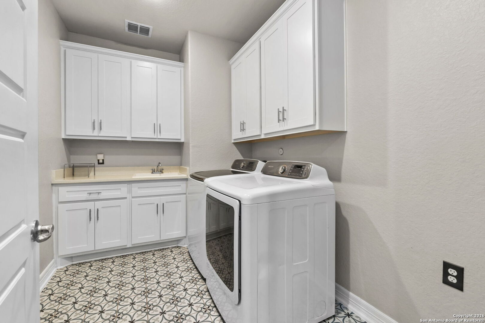 705 Tree Top Pass New Braunfels, TX 78130 - Photo 26 of 49 a utility room with sink dryer and washer