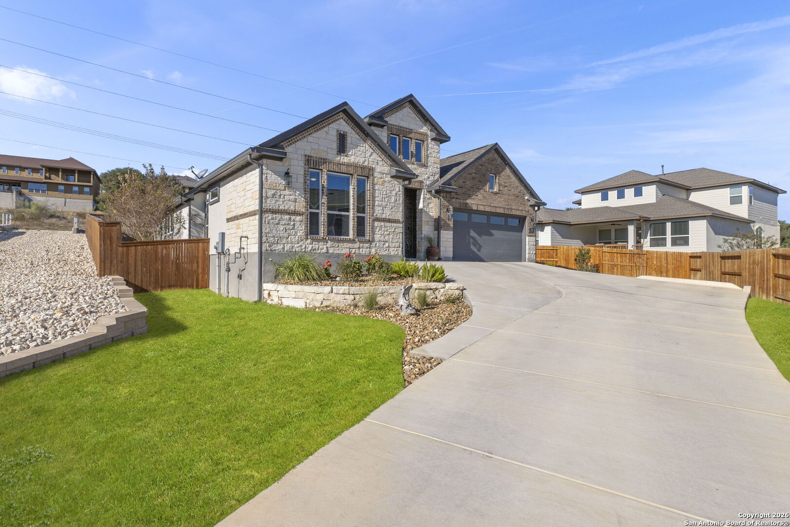 705 Tree Top Pass New Braunfels, TX 78130 - Photo 3 of 49 a front view of a house with a yard and potted plants