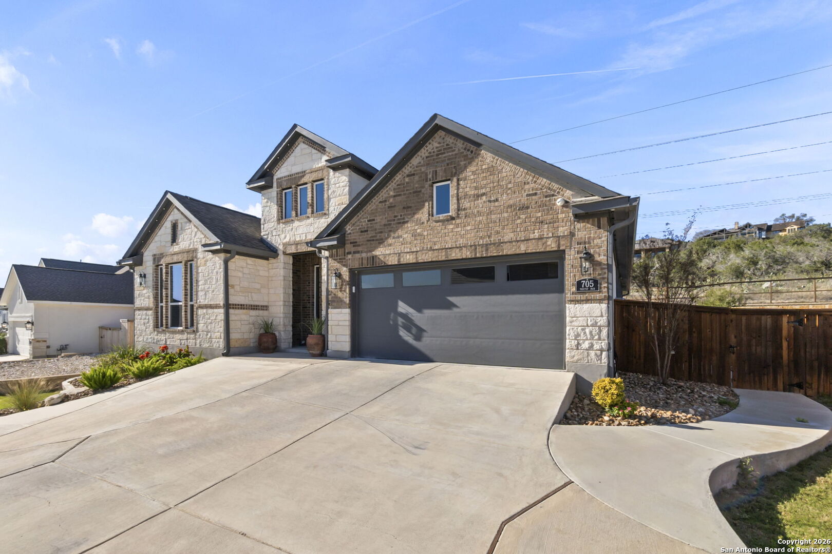 705 Tree Top Pass New Braunfels, TX 78130 - Photo 38 of 49 a front view of a house with yard and garage