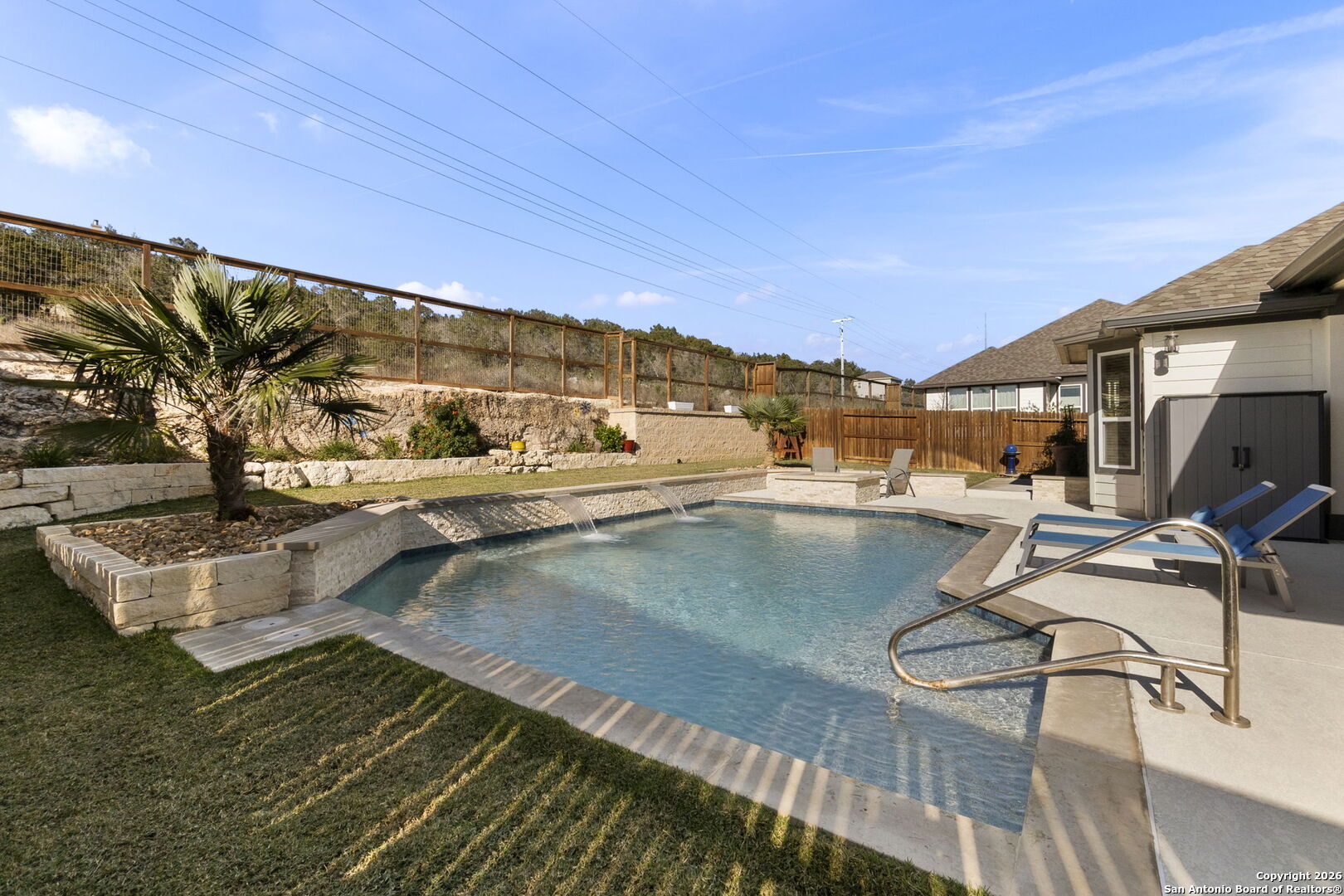 705 Tree Top Pass New Braunfels, TX 78130 - Photo 46 of 49 a view of a swimming pool with lounge chairs