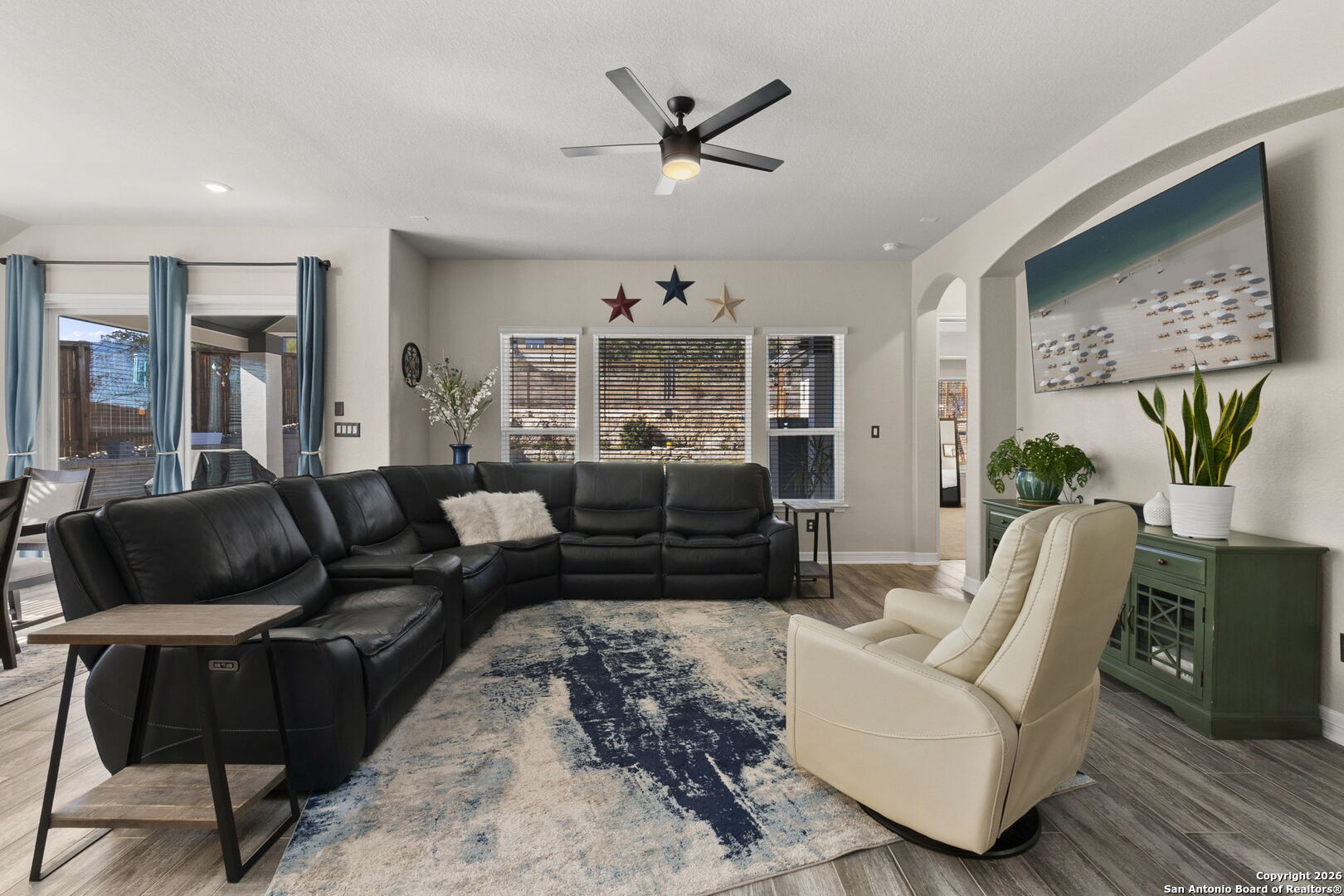 705 Tree Top Pass New Braunfels, TX 78130 - Photo 10 of 49 a living room with furniture ceiling fan and a rug