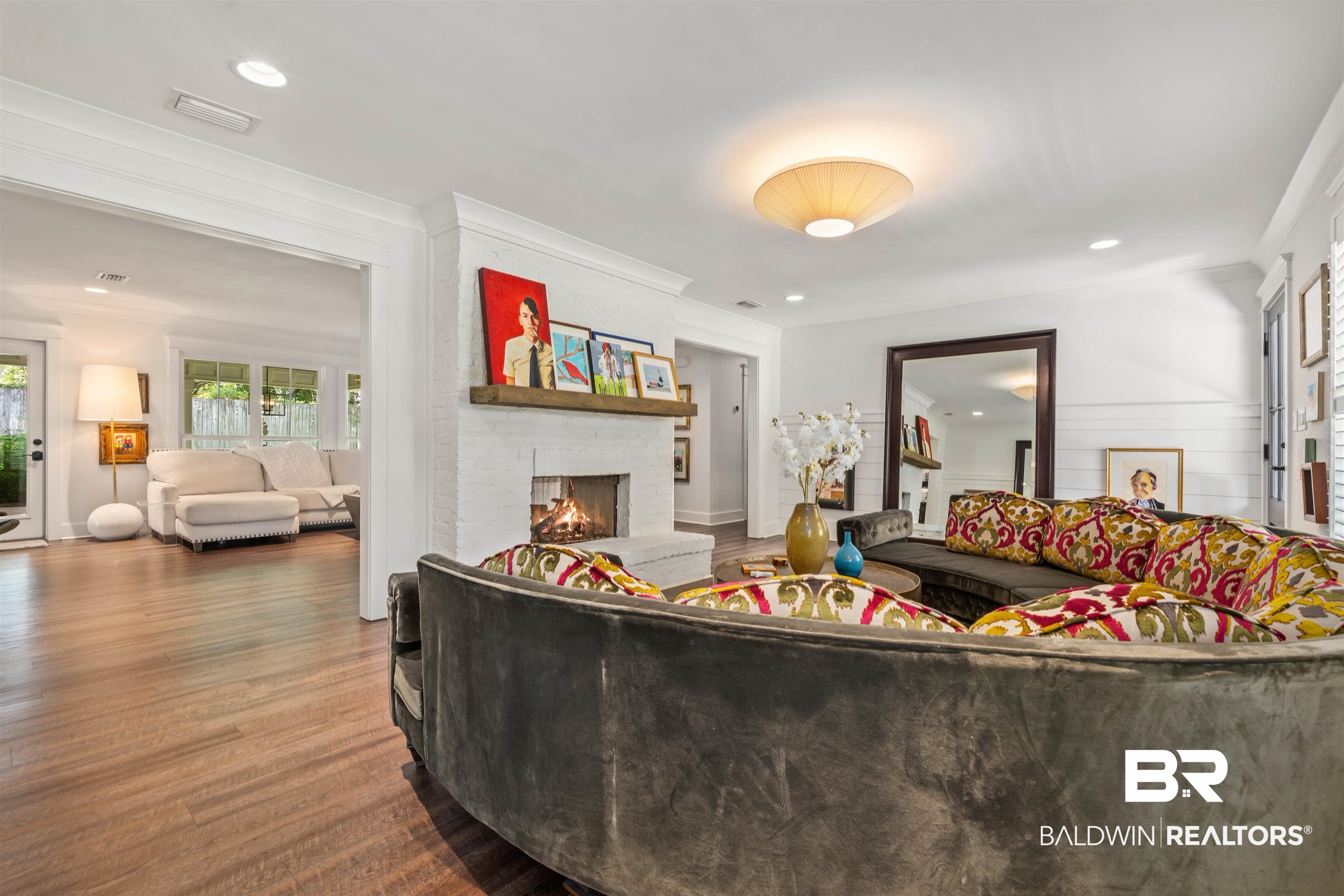 3808 Claridge Road North Mobile, AL 36608 - Photo 15 of 43 Living room featuring a brick fireplace, wood-type flooring, and ornamental molding
