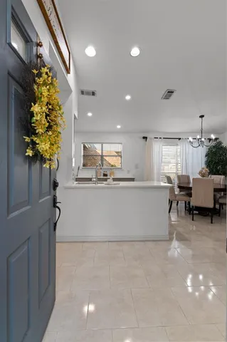 a view of kitchen with furniture and a potted plant