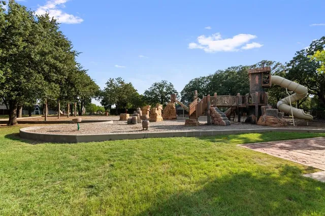 a view of a park with large trees