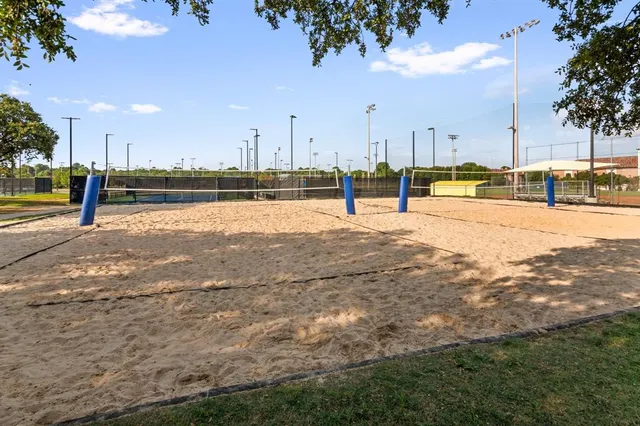 a view of a swimming pool with outdoor seating