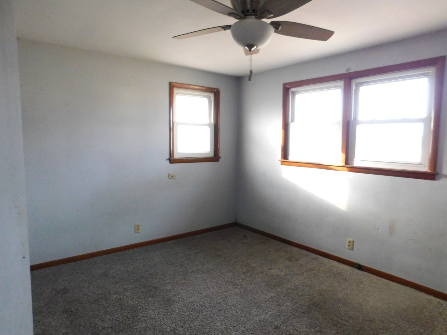 150 South Dixie Highway St. Anne, IL 60964 - Photo 13 of 15 an empty room with a window and a fan