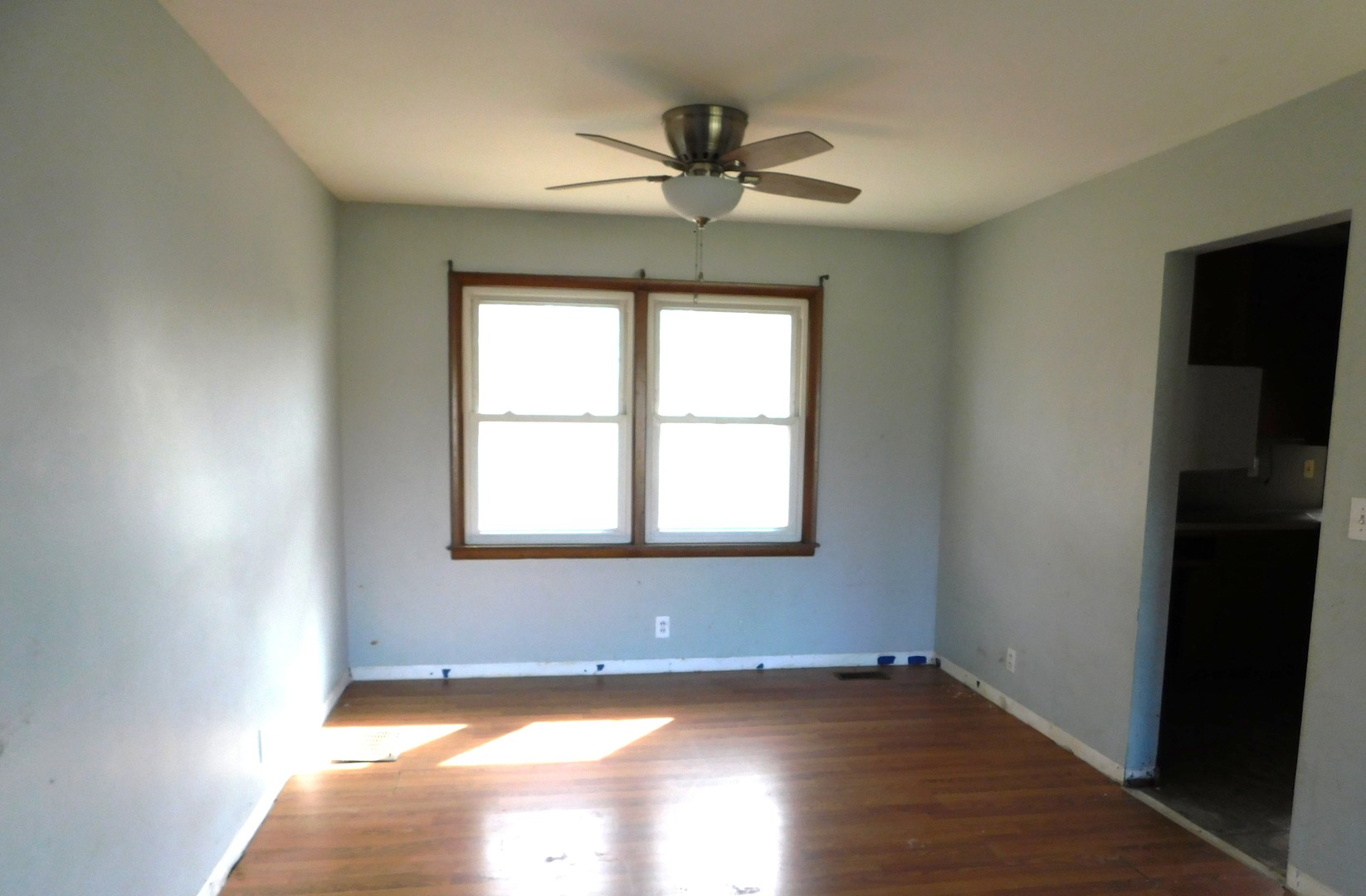 150 South Dixie Highway St. Anne, IL 60964 - Photo 5 of 15 a view of an empty room with wooden floor and a window