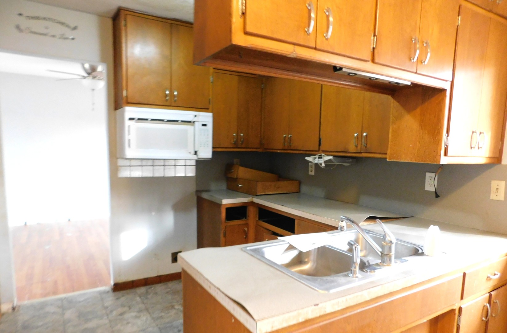 150 South Dixie Highway St. Anne, IL 60964 - Photo 6 of 15 a kitchen with a sink and a stove top oven