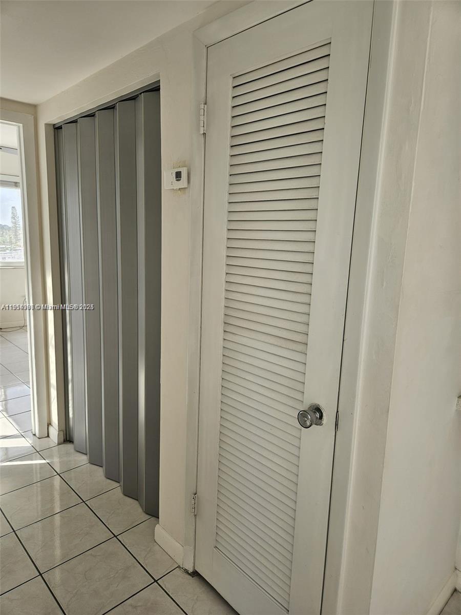 8001 Crespi Boulevard, Unit 6D Miami Beach, FL 33141 - Photo 14 of 29 a view of a bathroom with a shower