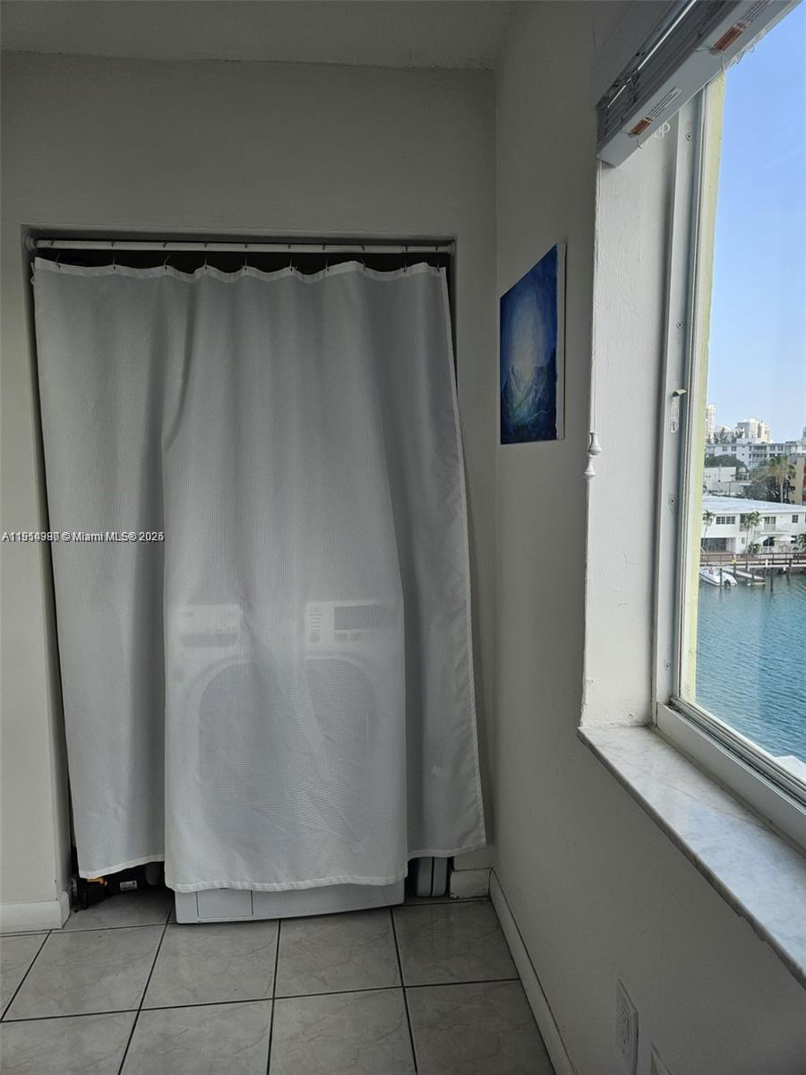 8001 Crespi Boulevard, Unit 6D Miami Beach, FL 33141 - Photo 19 of 29 a view of a walk in closet