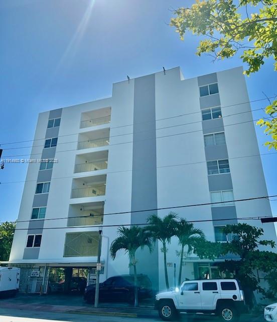 8001 Crespi Boulevard, Unit 6D Miami Beach, FL 33141 - Photo 21 of 29 a front view of a house with a yard