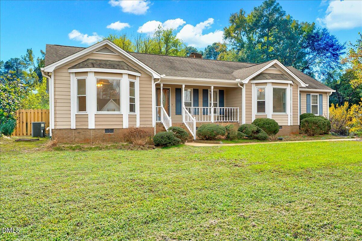 2805 Mary Marvin Trail Willow Spring, NC 27592 - Photo 2 of 33 a front view of a house with garden