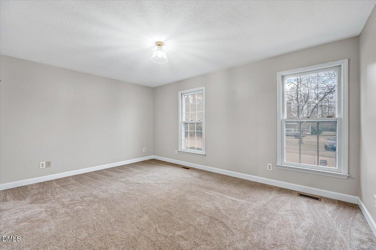2805 Mary Marvin Trail Willow Spring, NC 27592 - Photo 21 of 33 an empty room with windows