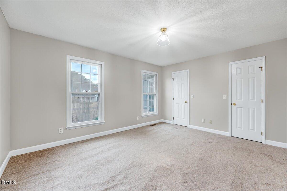 2805 Mary Marvin Trail Willow Spring, NC 27592 - Photo 23 of 33 an empty room with windows and closet