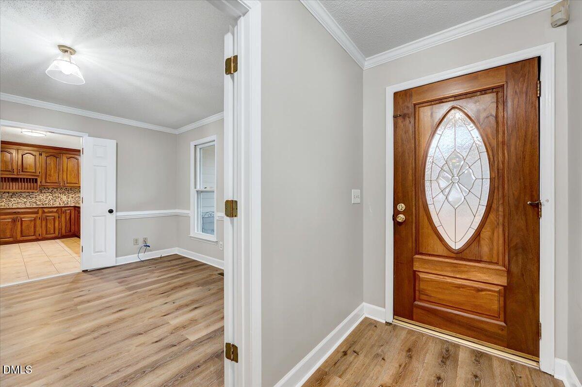 2805 Mary Marvin Trail Willow Spring, NC 27592 - Photo 4 of 33 a view of front door with wooden floor