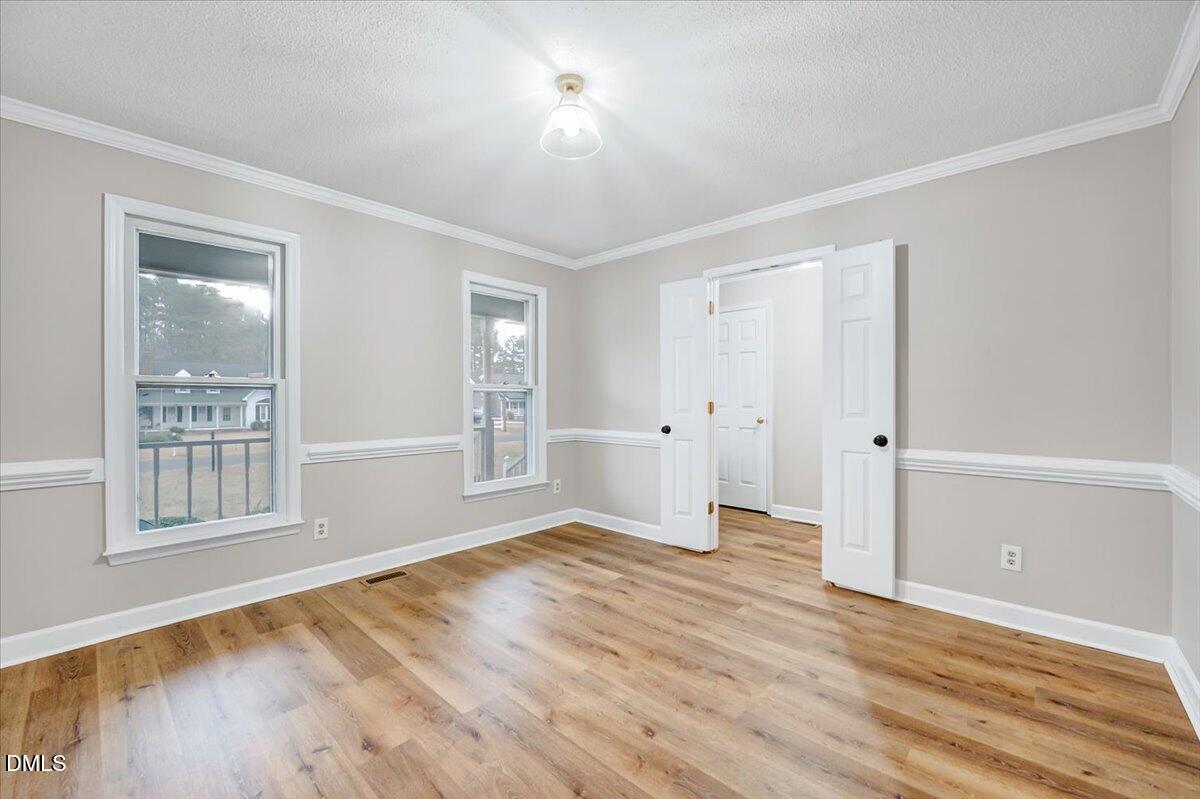 2805 Mary Marvin Trail Willow Spring, NC 27592 - Photo 5 of 33 a view of empty room with wooden floor and fan