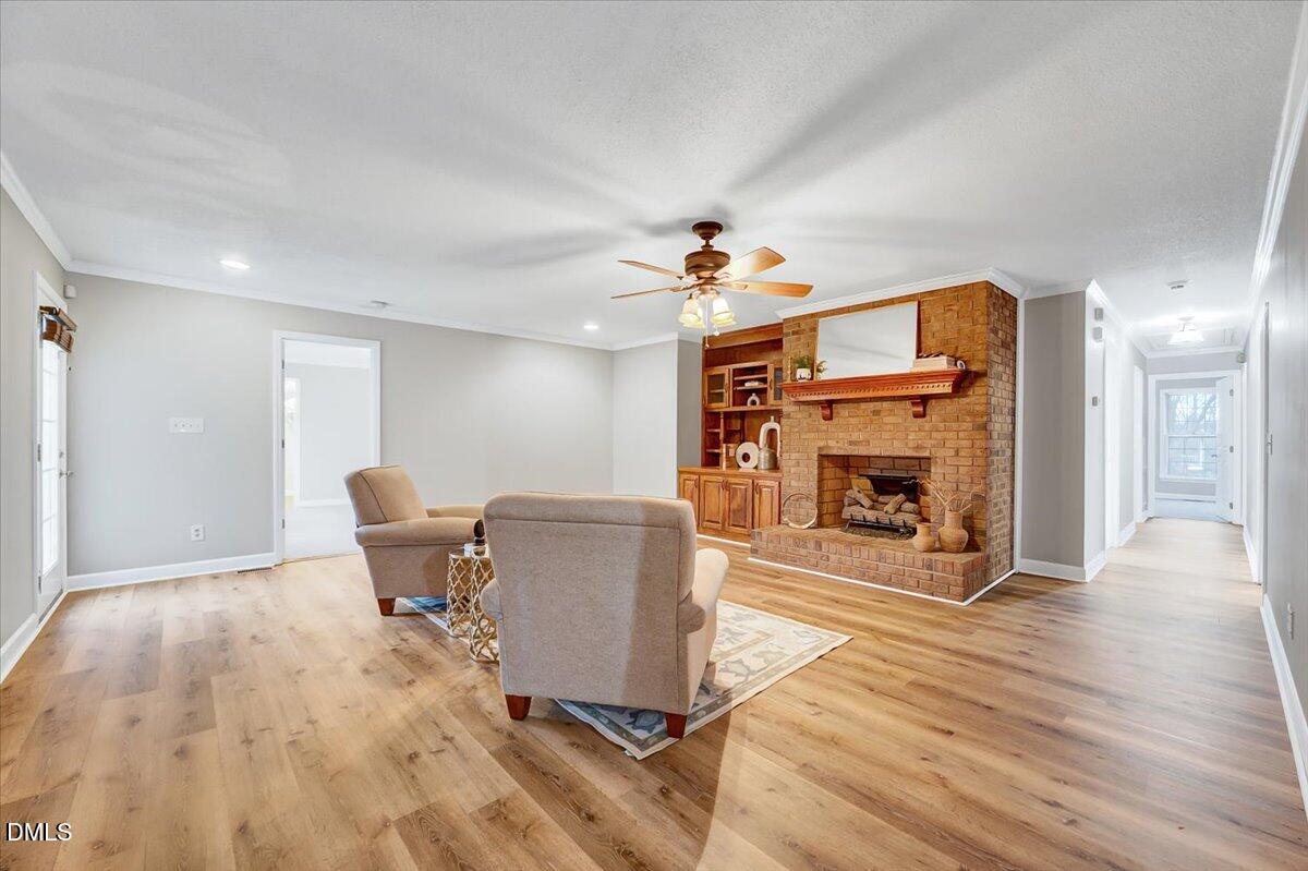 2805 Mary Marvin Trail Willow Spring, NC 27592 - Photo 7 of 33 a living room with furniture and a fireplace