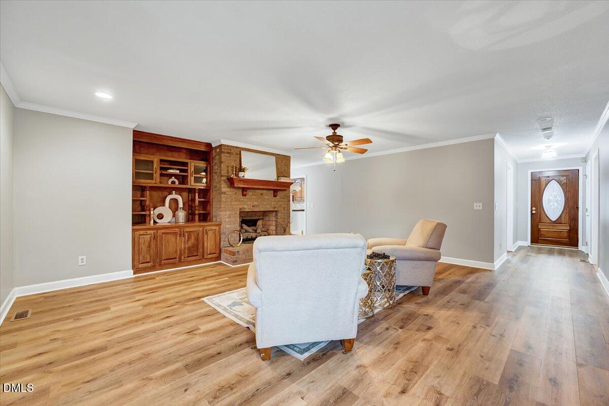 2805 Mary Marvin Trail Willow Spring, NC 27592 - Photo 8 of 33 a living room with furniture and a wooden floor