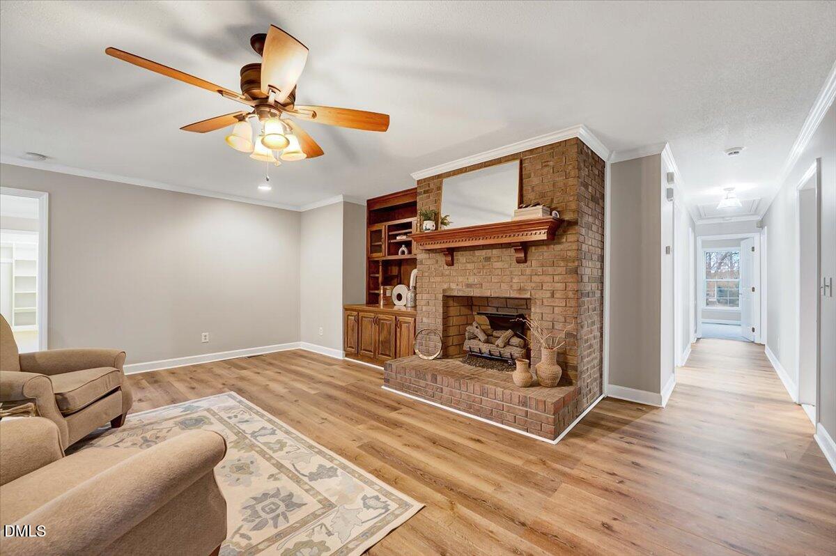 2805 Mary Marvin Trail Willow Spring, NC 27592 - Photo 9 of 33 a living room with furniture and a fireplace