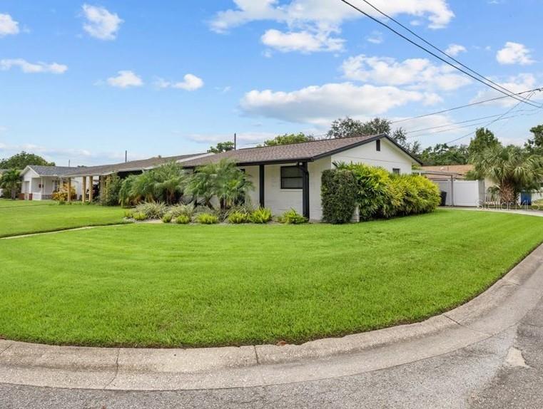 3488 40th Way North St. Petersburg, FL 33713 - Photo 2 of 70 a view of a house with a big yard and potted plants