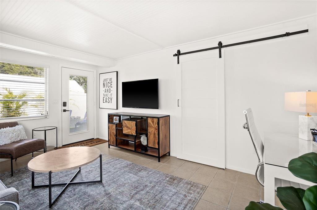 3488 40th Way North St. Petersburg, FL 33713 - Photo 21 of 70 a living room with furniture and a flat screen tv