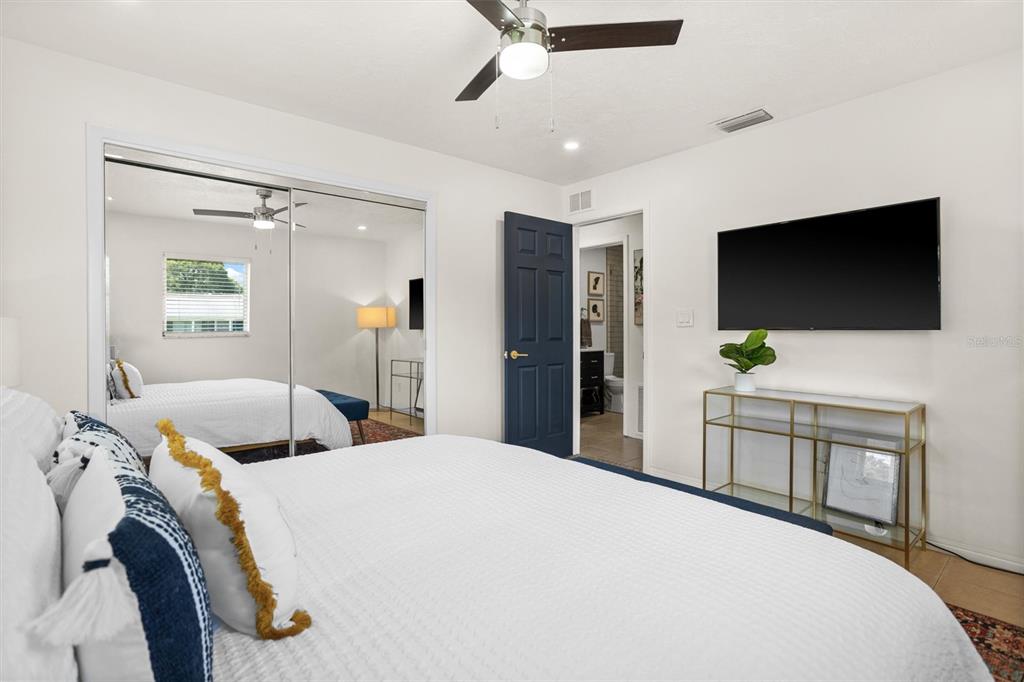 3488 40th Way North St. Petersburg, FL 33713 - Photo 37 of 70 a bedroom with a bed and a flat screen tv