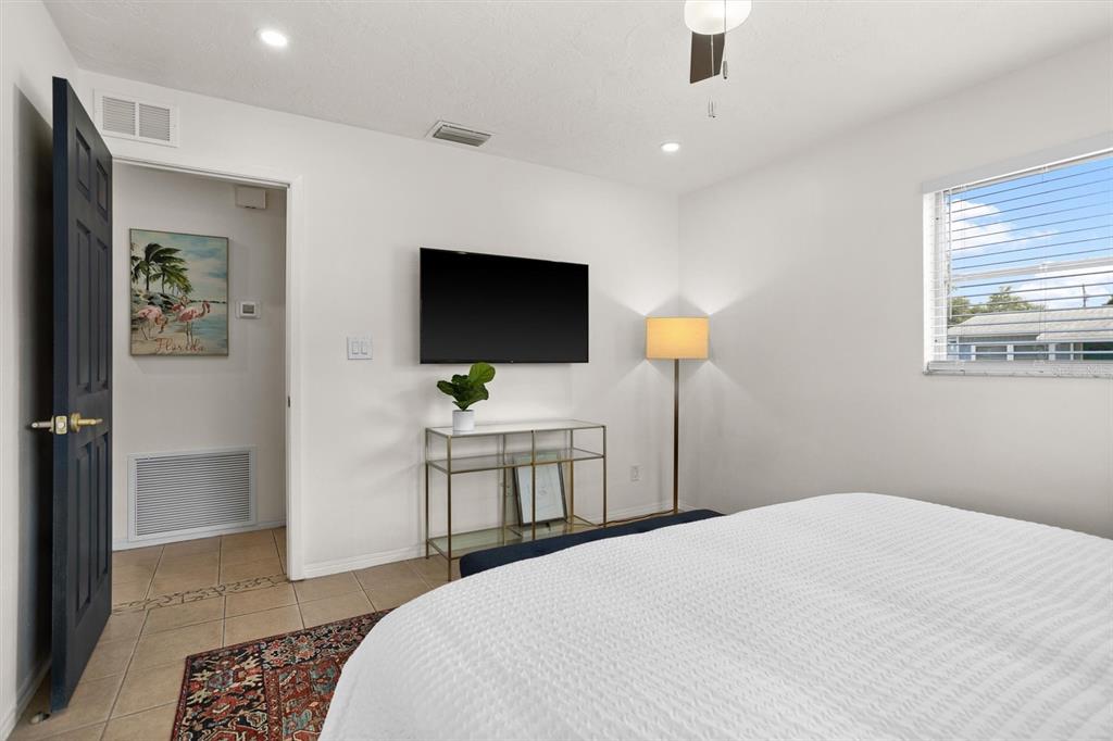 3488 40th Way North St. Petersburg, FL 33713 - Photo 38 of 70 a bedroom with a bed and a flat screen tv