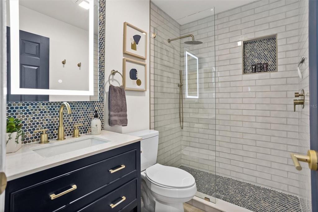 3488 40th Way North St. Petersburg, FL 33713 - Photo 40 of 70 a bathroom with a sink a toilet and shower