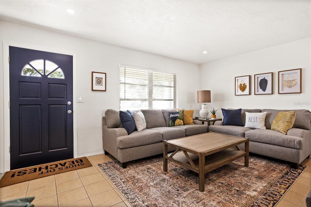 3488 40th Way North St. Petersburg, FL 33713 - Photo 4 of 70 a living room with furniture a window and a table