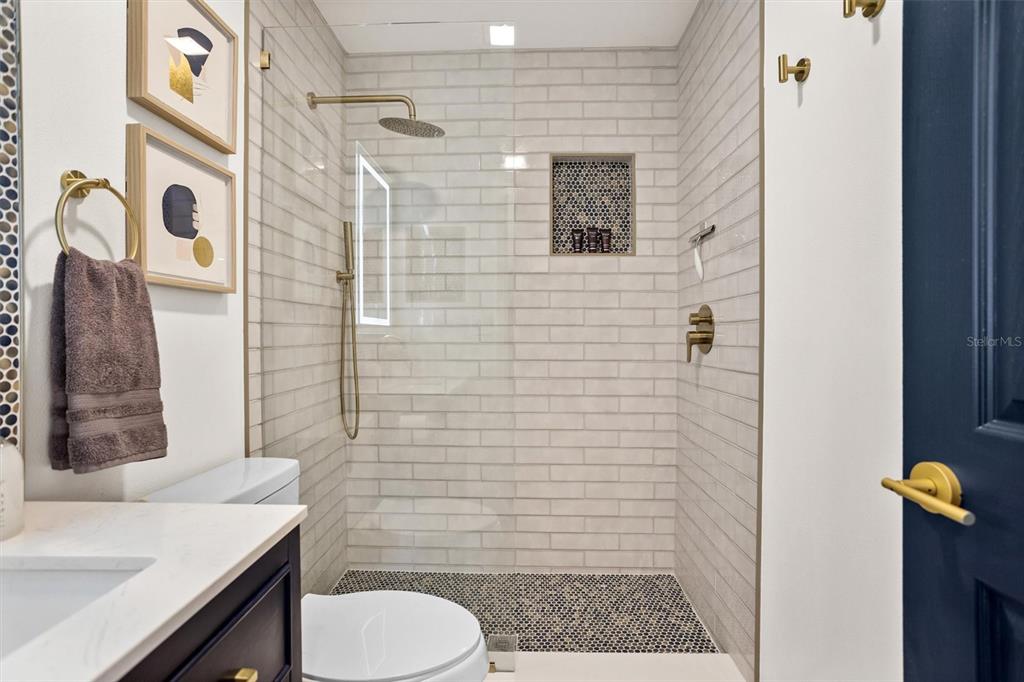 3488 40th Way North St. Petersburg, FL 33713 - Photo 43 of 70 a bathroom with a sink toilet and shower