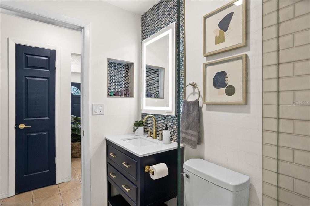 3488 40th Way North St. Petersburg, FL 33713 - Photo 45 of 70 a bathroom with a sink a toilet and shower