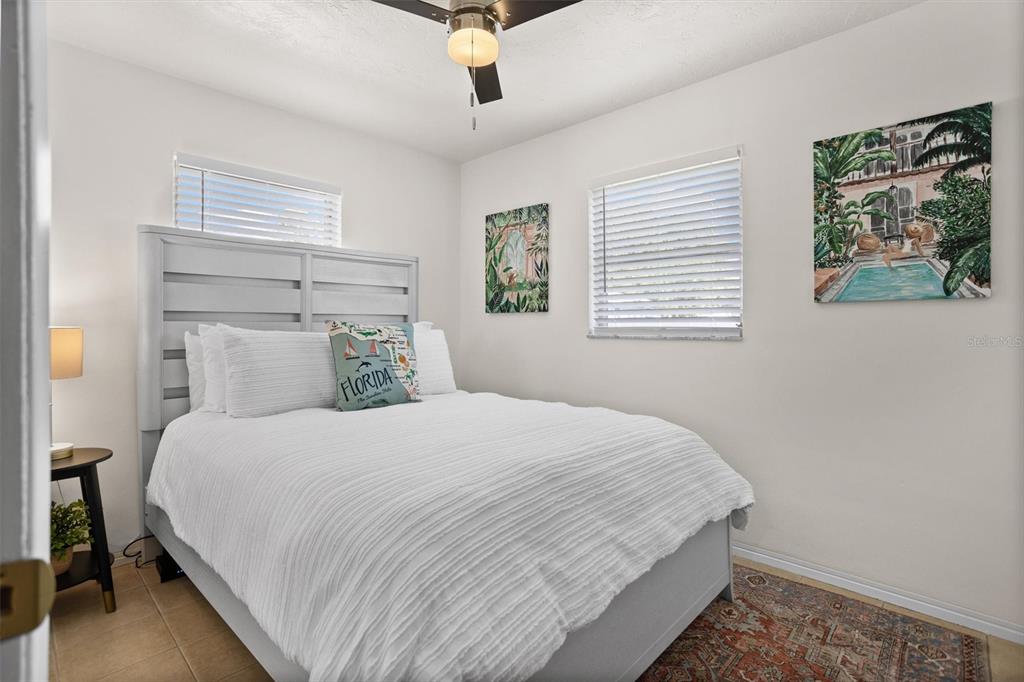 3488 40th Way North St. Petersburg, FL 33713 - Photo 46 of 70 a bedroom with a large bed and a window