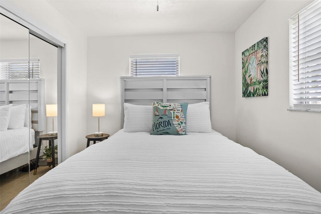 3488 40th Way North St. Petersburg, FL 33713 - Photo 47 of 70 a bedroom with a large bed and a window