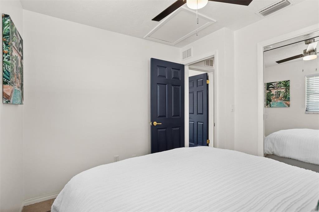 3488 40th Way North St. Petersburg, FL 33713 - Photo 49 of 70 a bedroom with a bed and a chandelier