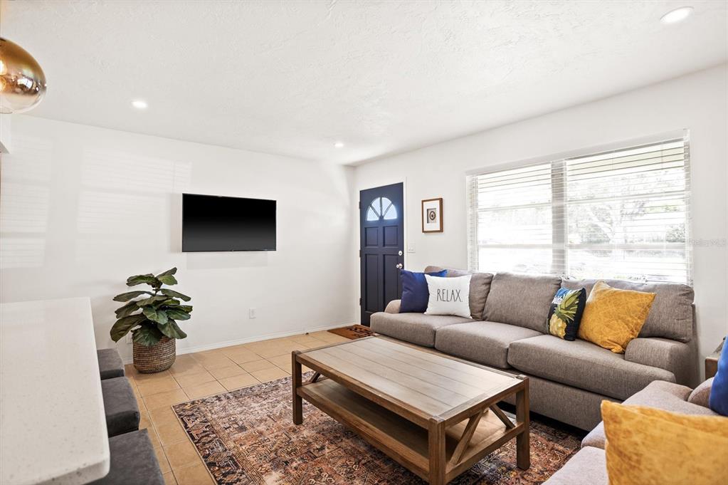 3488 40th Way North St. Petersburg, FL 33713 - Photo 5 of 70 a living room with furniture and a flat screen tv