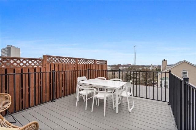a view of a chairs and table on the deck