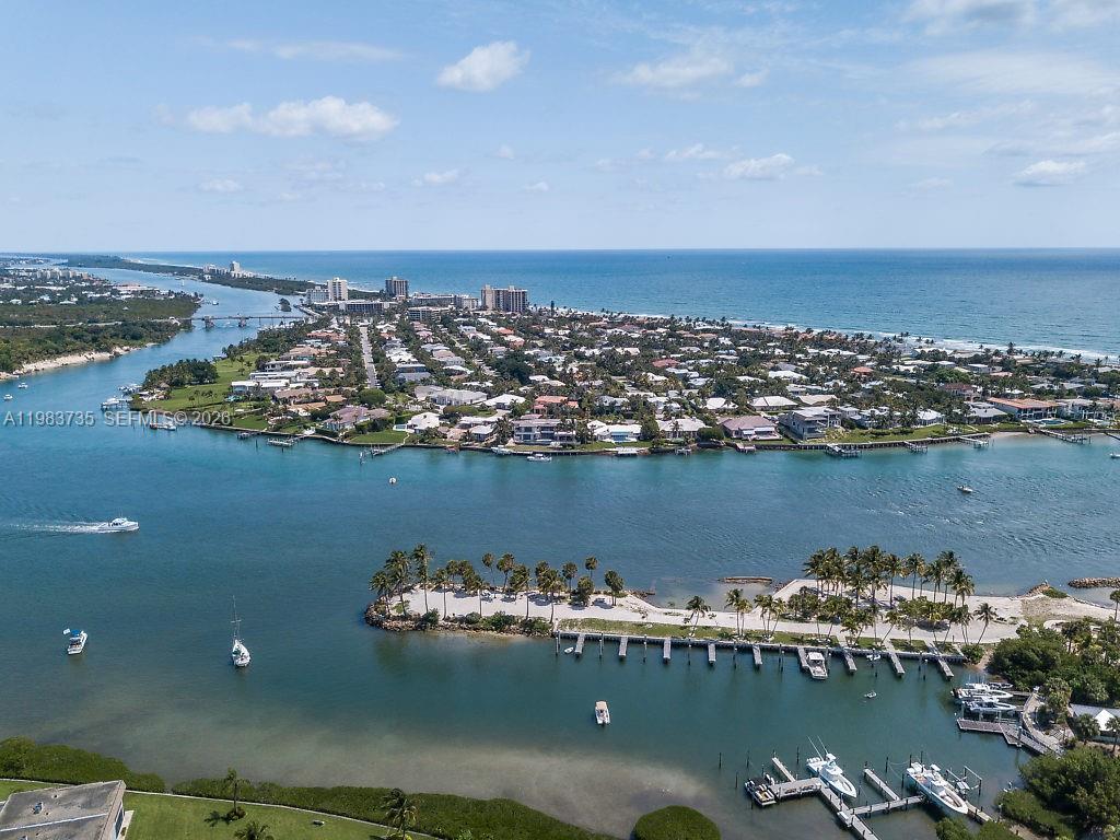 an aerial view of a houses with ocean view