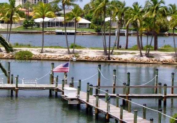 851 Saturn Street, Unit D Jupiter, FL 33477 - Photo 30 of 60 a view of a chairs and table on the terrace