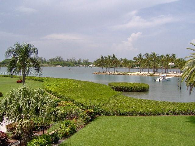 851 Saturn Street, Unit D Jupiter, FL 33477 - Photo 34 of 60 a view of a lake with houses in the back