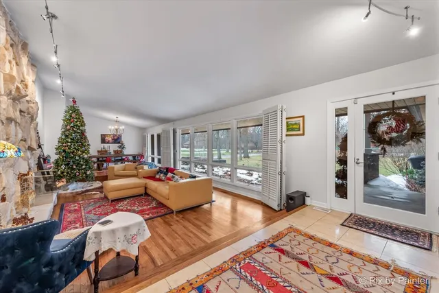 a view of a dining room with furniture wooden floor and chandelier