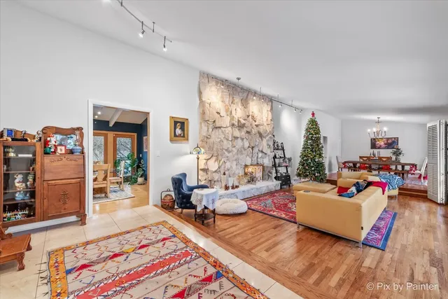 a bed room with furniture and a flat screen tv