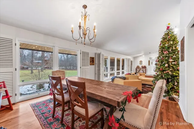 a bed room with a bed and a chandelier