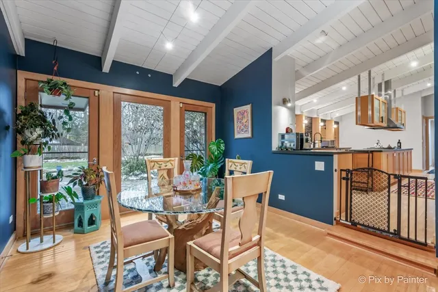 a view of balcony with wooden floor and seating space